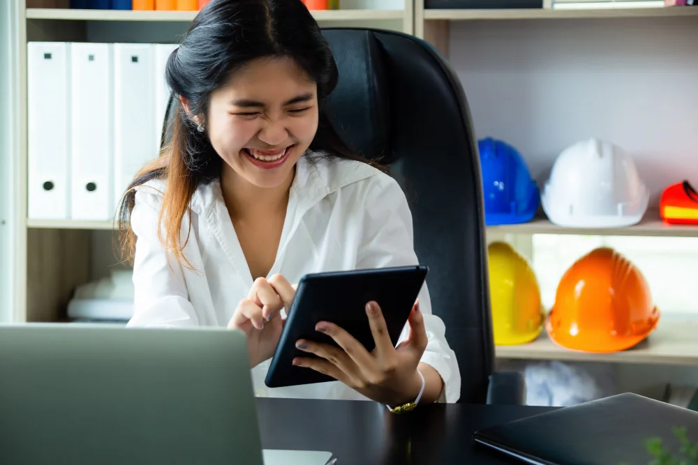 Business support specialist tracking schedules and task updates through a digital coordination platform