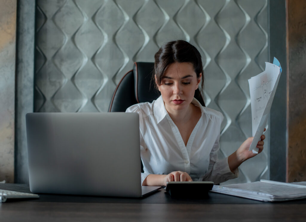 Administrative support specialist managing tax documents and financial records to help businesses meet tax deadlines efficiently