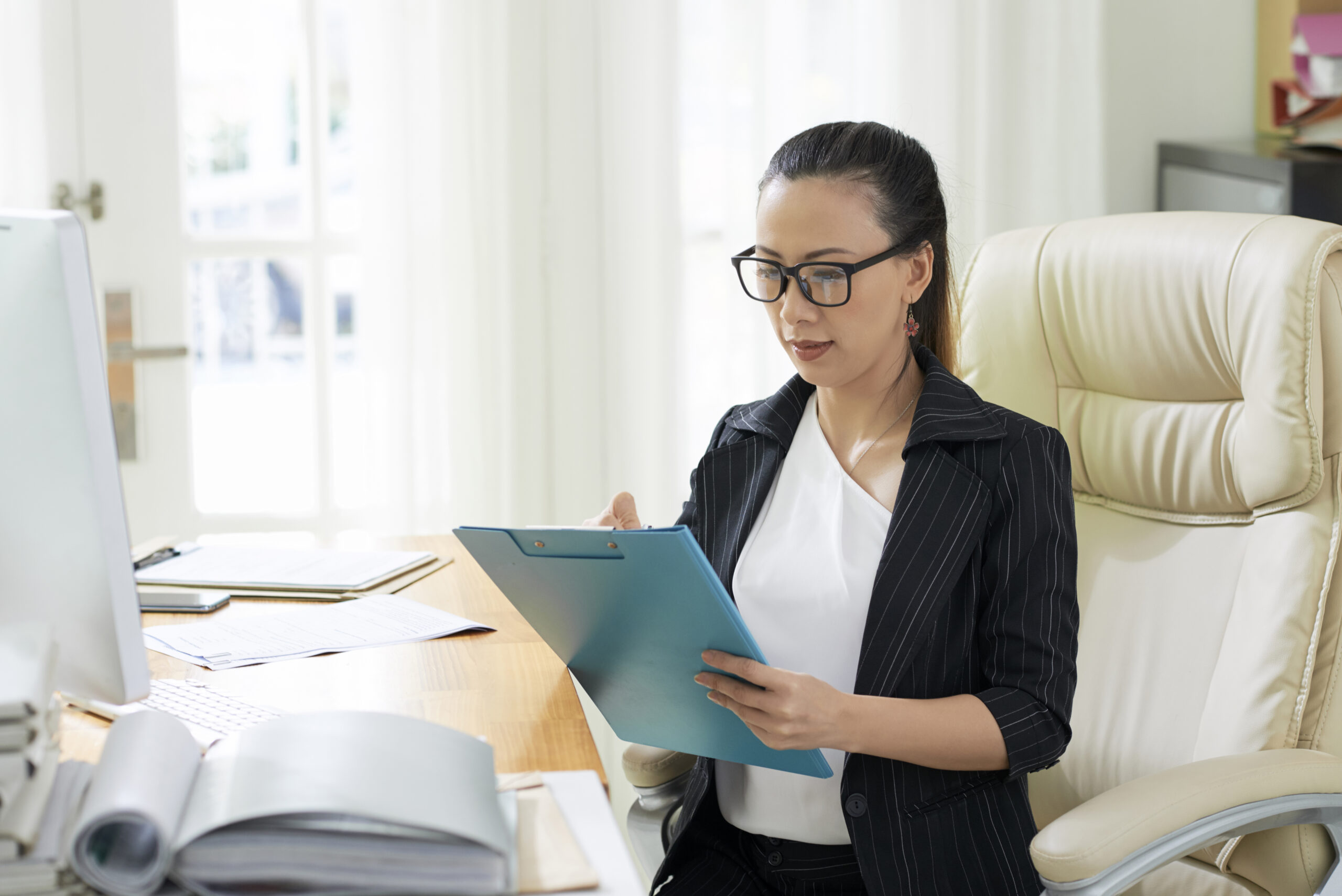 Administrative assistant managing real estate workflow